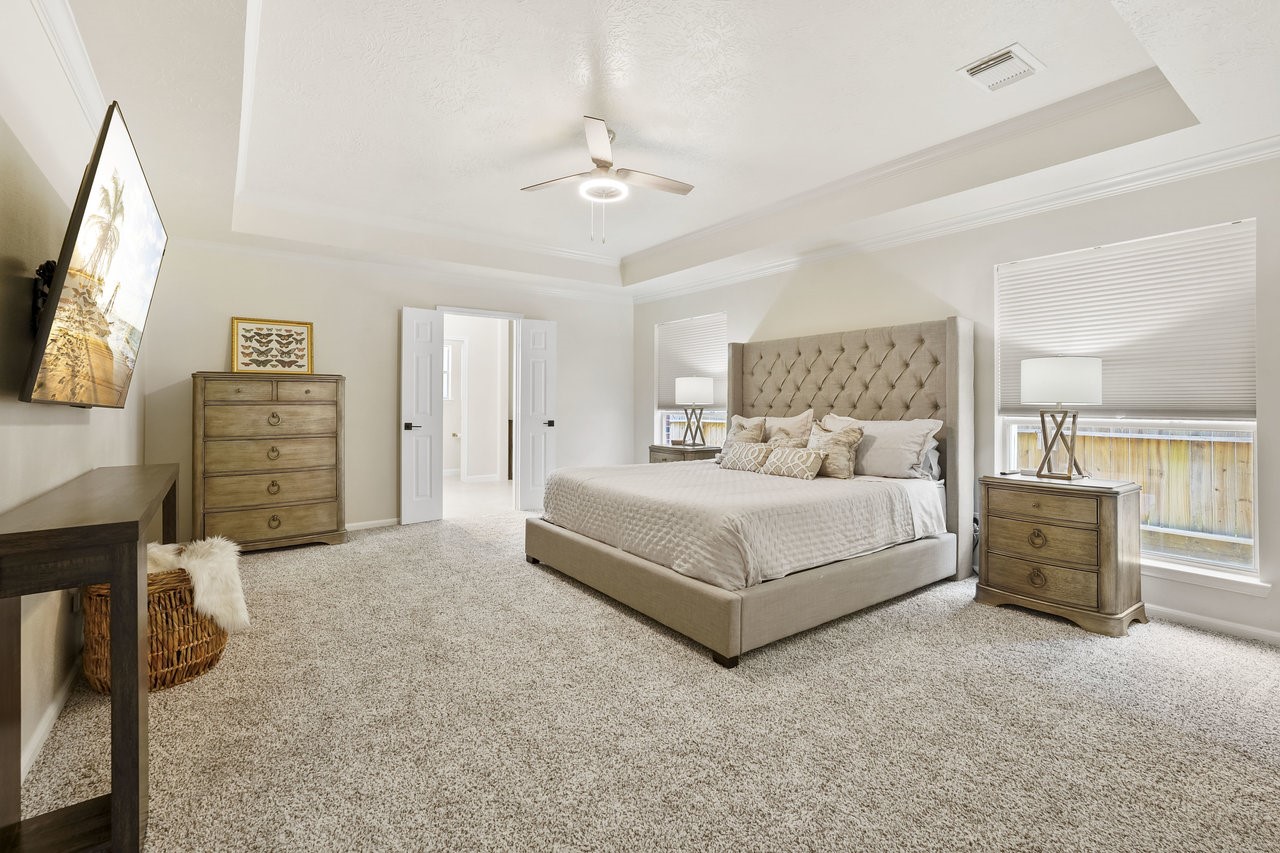8615 Discus Drive Humble, TX 77346 - Photo 4 of 50 a bedroom with a bed and dresser