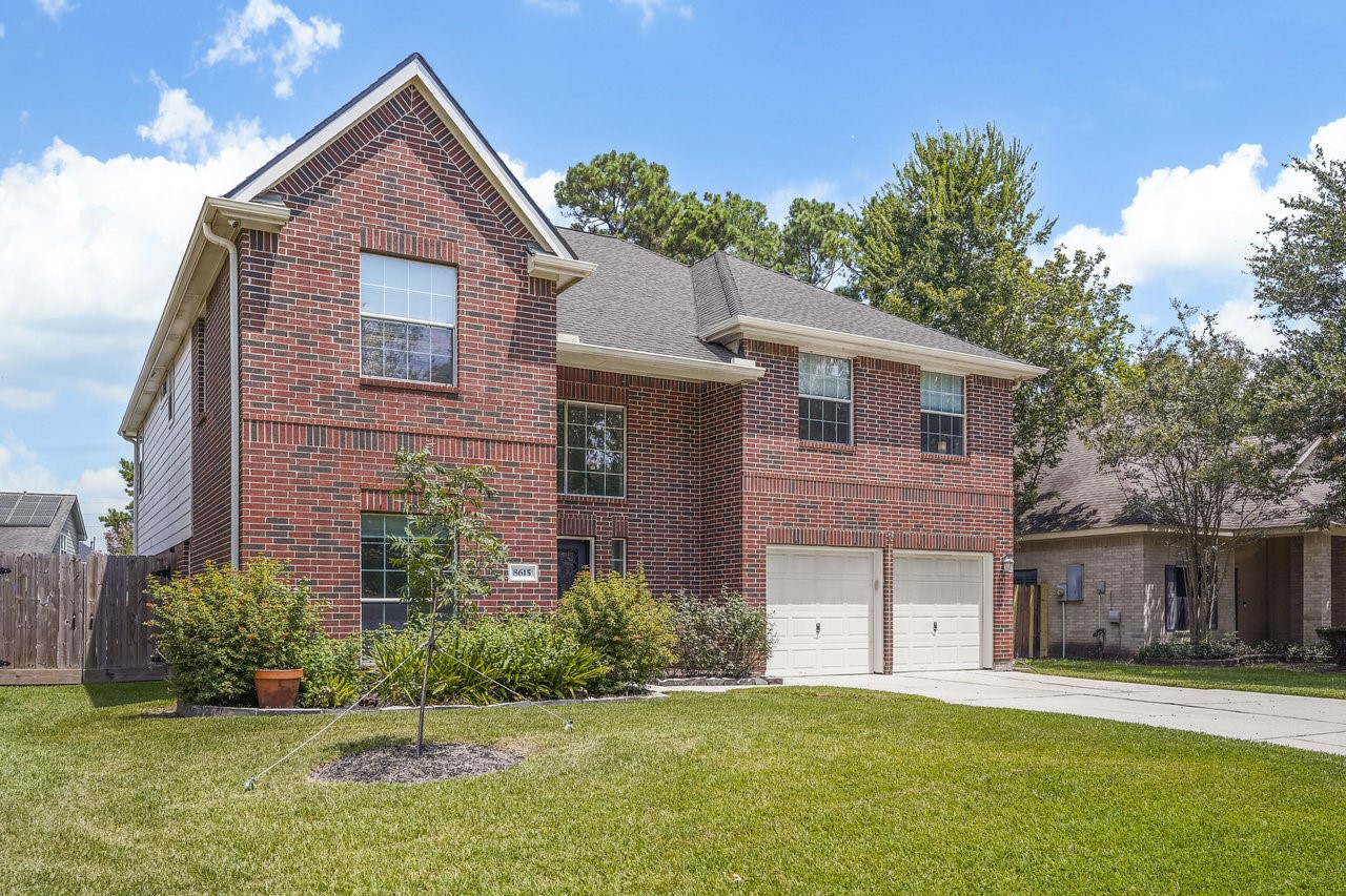 8615 Discus Drive Humble, TX 77346 - Photo 43 of 50 a front view of a house with a yard