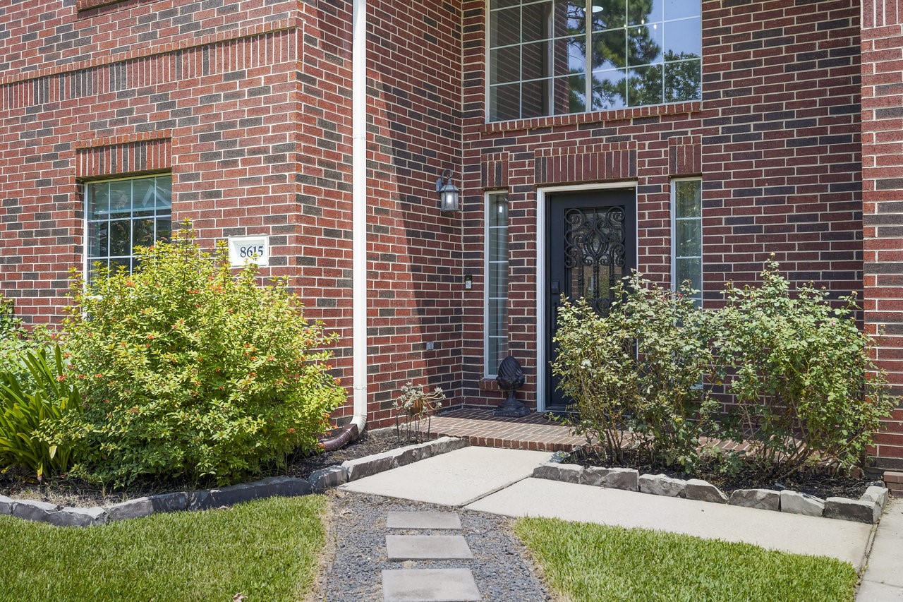 8615 Discus Drive Humble, TX 77346 - Photo 44 of 50 a front view of a house with garden