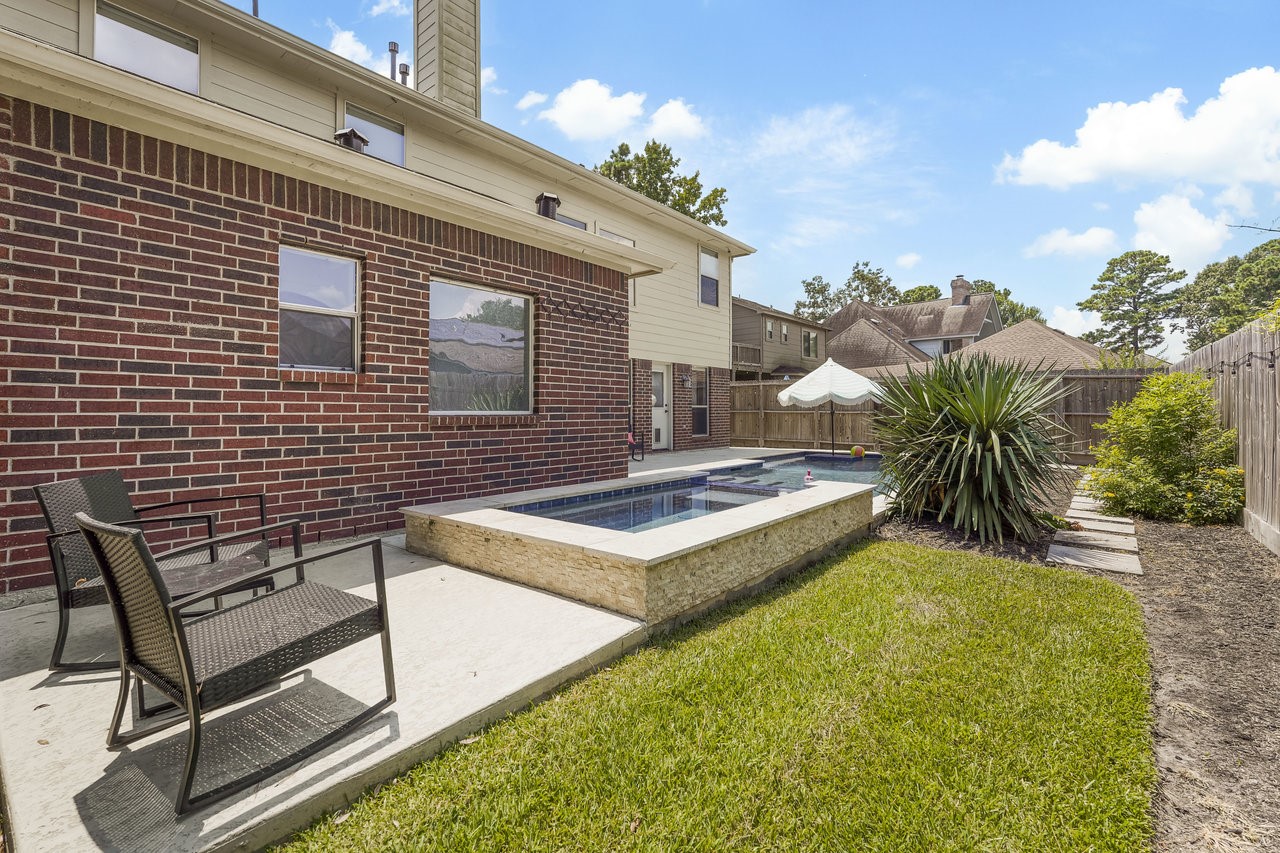 8615 Discus Drive Humble, TX 77346 - Photo 46 of 50 a view of a backyard with plants and a patio