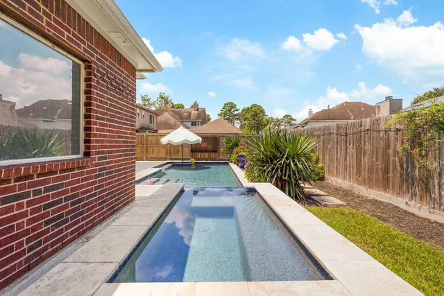 a view of balcony with wooden floor