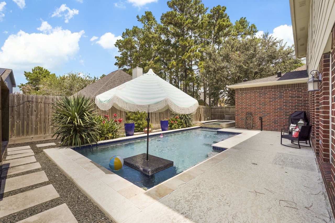 8615 Discus Drive Humble, TX 77346 - Photo 48 of 50 swimming pool view with a seating space