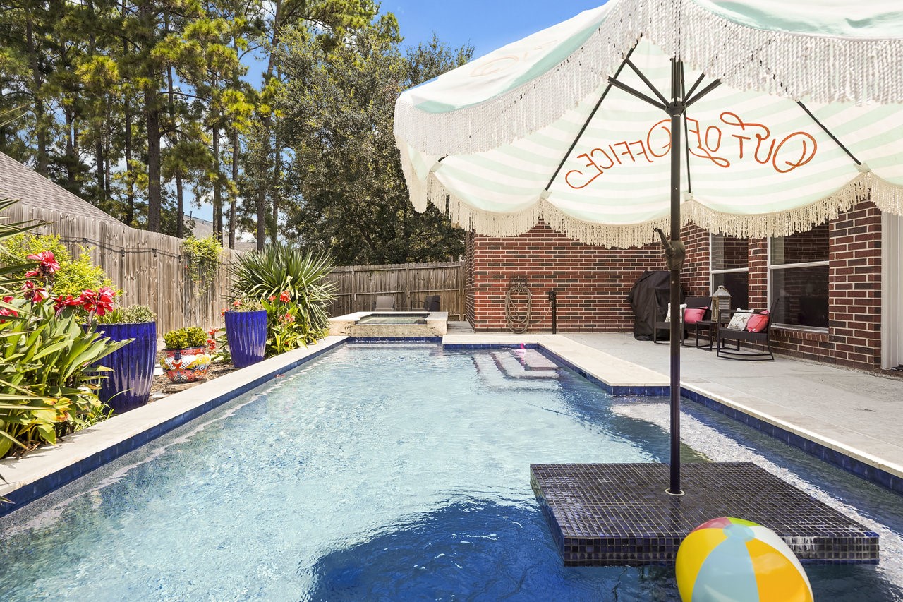 8615 Discus Drive Humble, TX 77346 - Photo 50 of 50 a view of a swimming pool with a patio