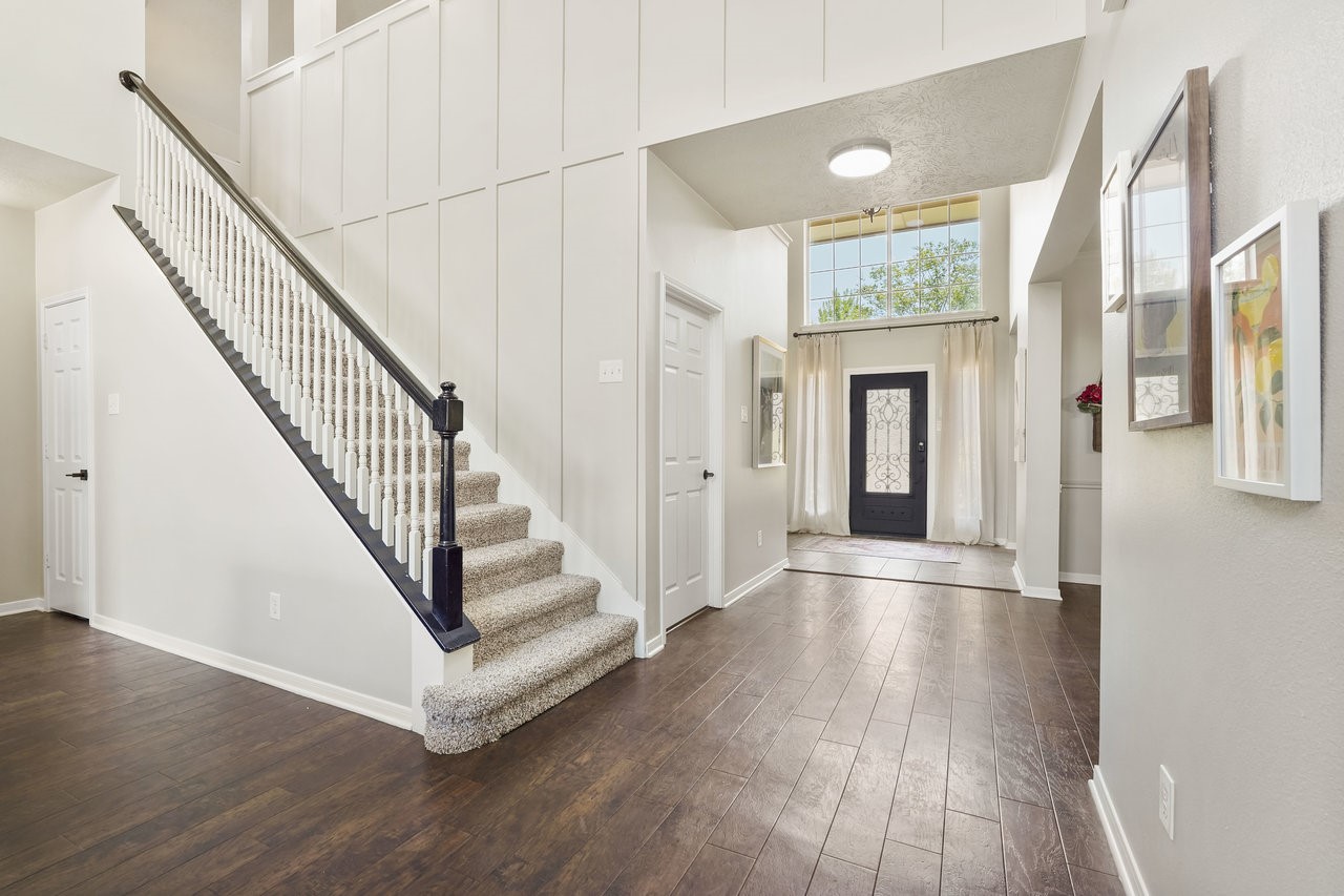 8615 Discus Drive Humble, TX 77346 - Photo 8 of 50 a view of entryway with wooden floor and stairs