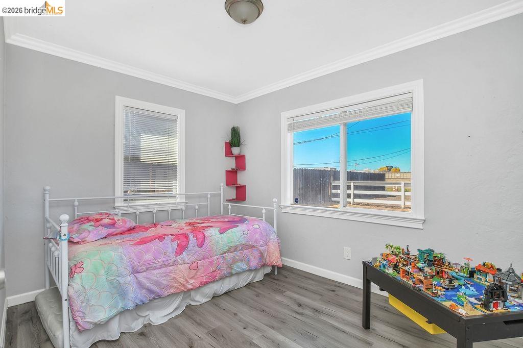 2191 East Cypress Road Oakley, CA 94561 - Photo 14 of 46 a bedroom with a bed and a window