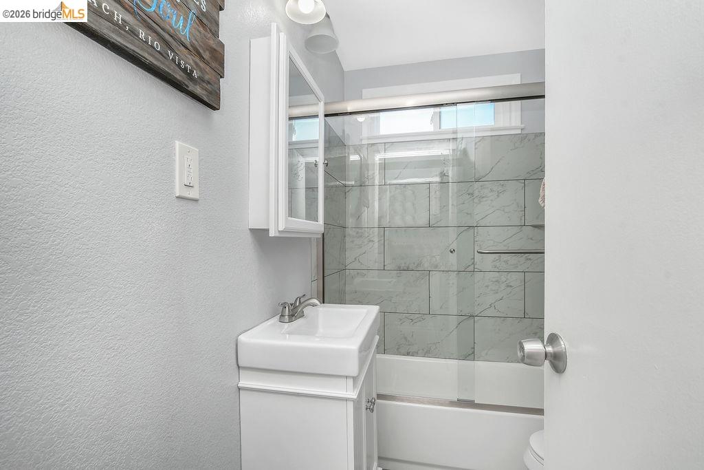 2191 East Cypress Road Oakley, CA 94561 - Photo 15 of 46 a bathroom with a sink toilet and shower
