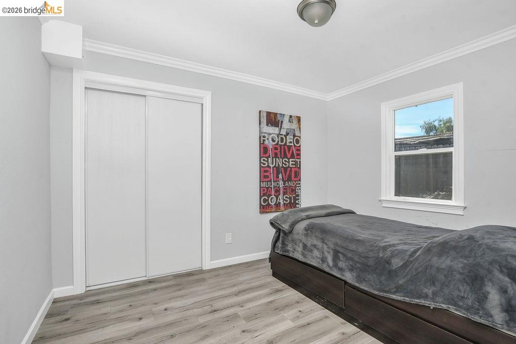 2191 East Cypress Road Oakley, CA 94561 - Photo 16 of 46 a bedroom with a bed and a window