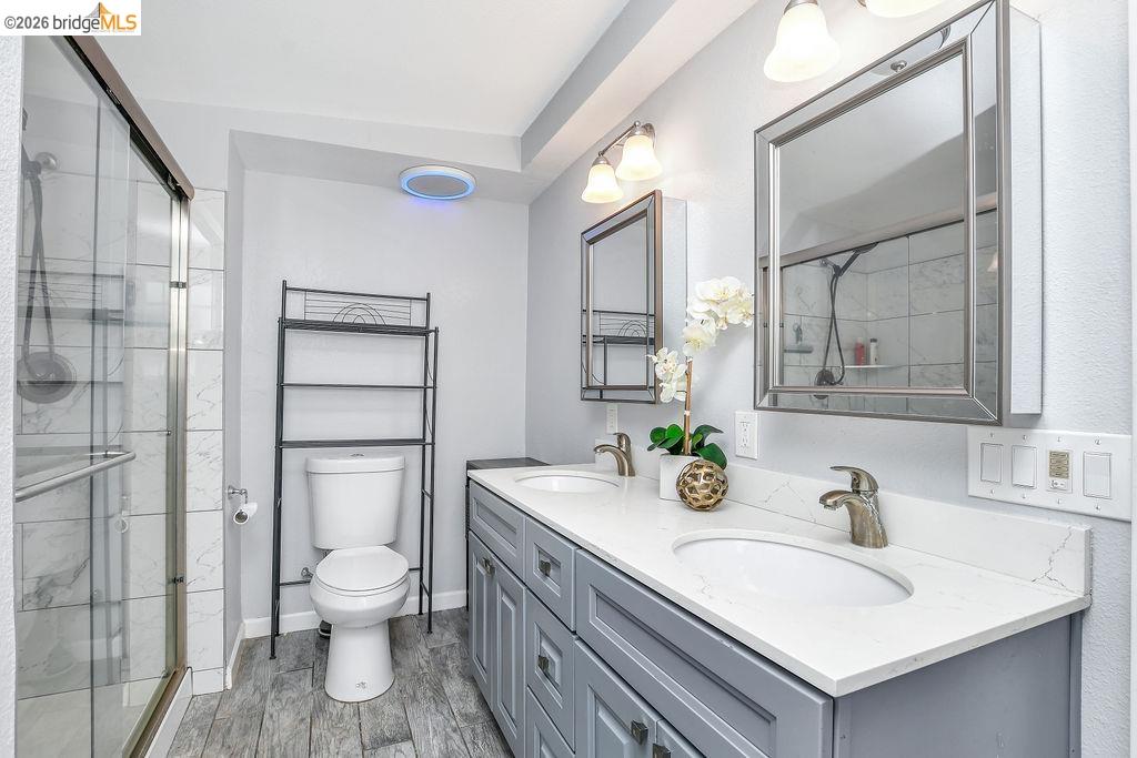 2191 East Cypress Road Oakley, CA 94561 - Photo 19 of 46 a bathroom with a sink toilet and shower