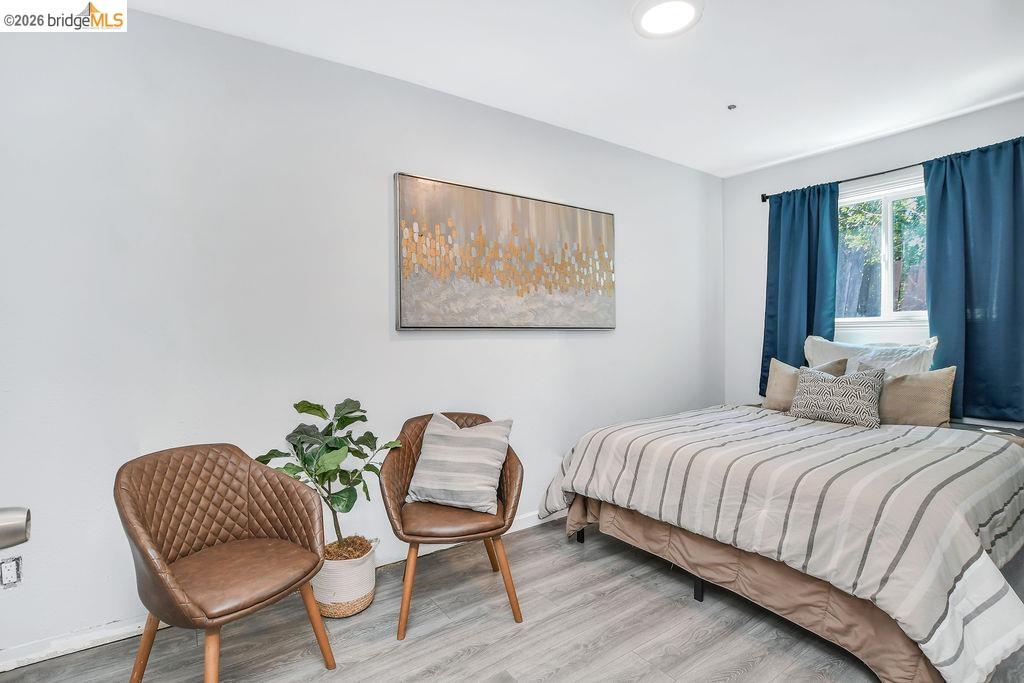 2191 East Cypress Road Oakley, CA 94561 - Photo 24 of 46 a bedroom with a bed chair and a window