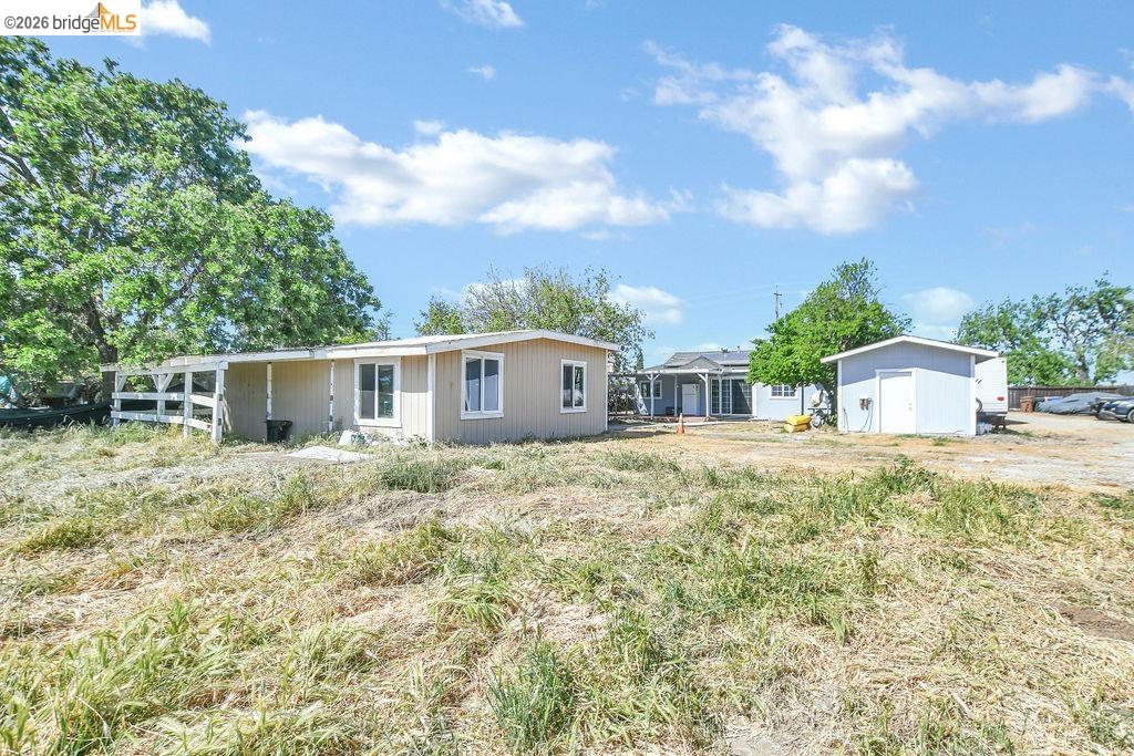 2191 East Cypress Road Oakley, CA 94561 - Photo 31 of 46 a large tree in front of a house