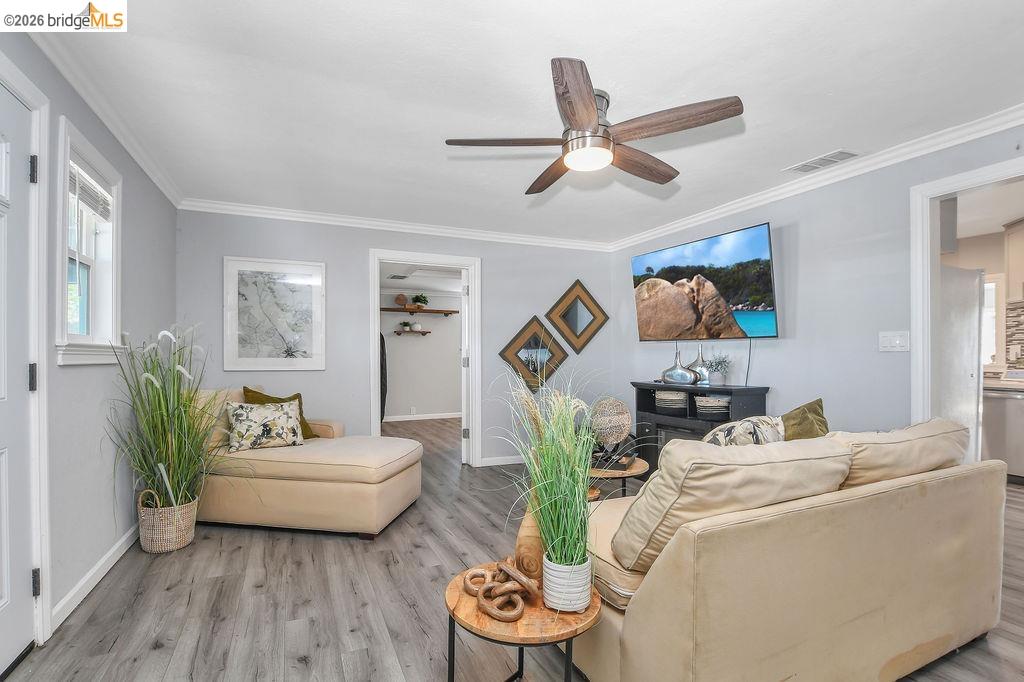 2191 East Cypress Road Oakley, CA 94561 - Photo 4 of 46 a living room with furniture and a wooden floor