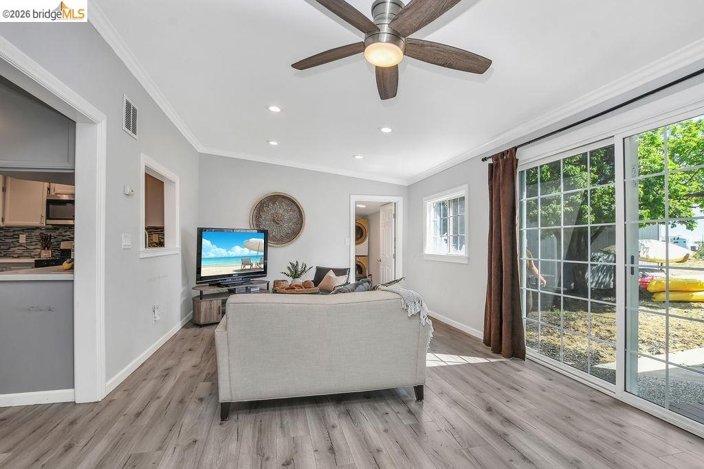 2191 East Cypress Road Oakley, CA 94561 - Photo 10 of 46 a living room with furniture and a large window