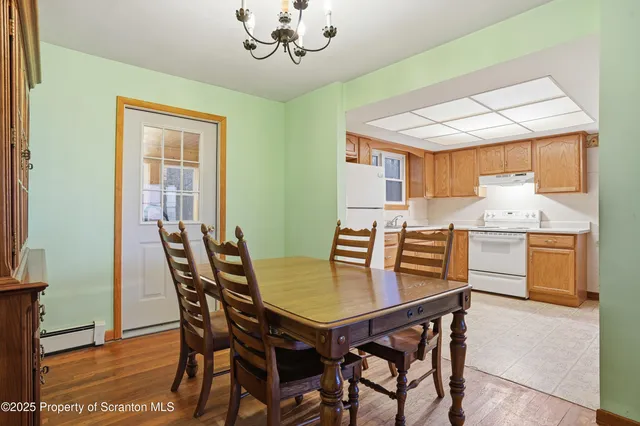a view of a dining room with furniture and window