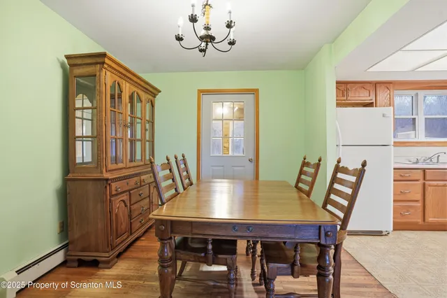 a view of a dining room with furniture and window