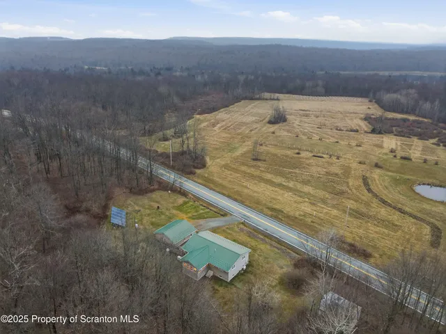 a view of swimming pool from a yard