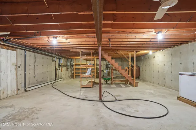 a view of a room with wooden floor and windows