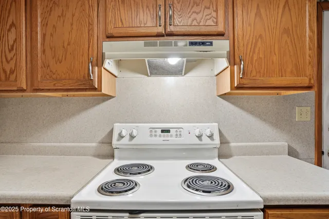 a kitchen with a stove and a microwave