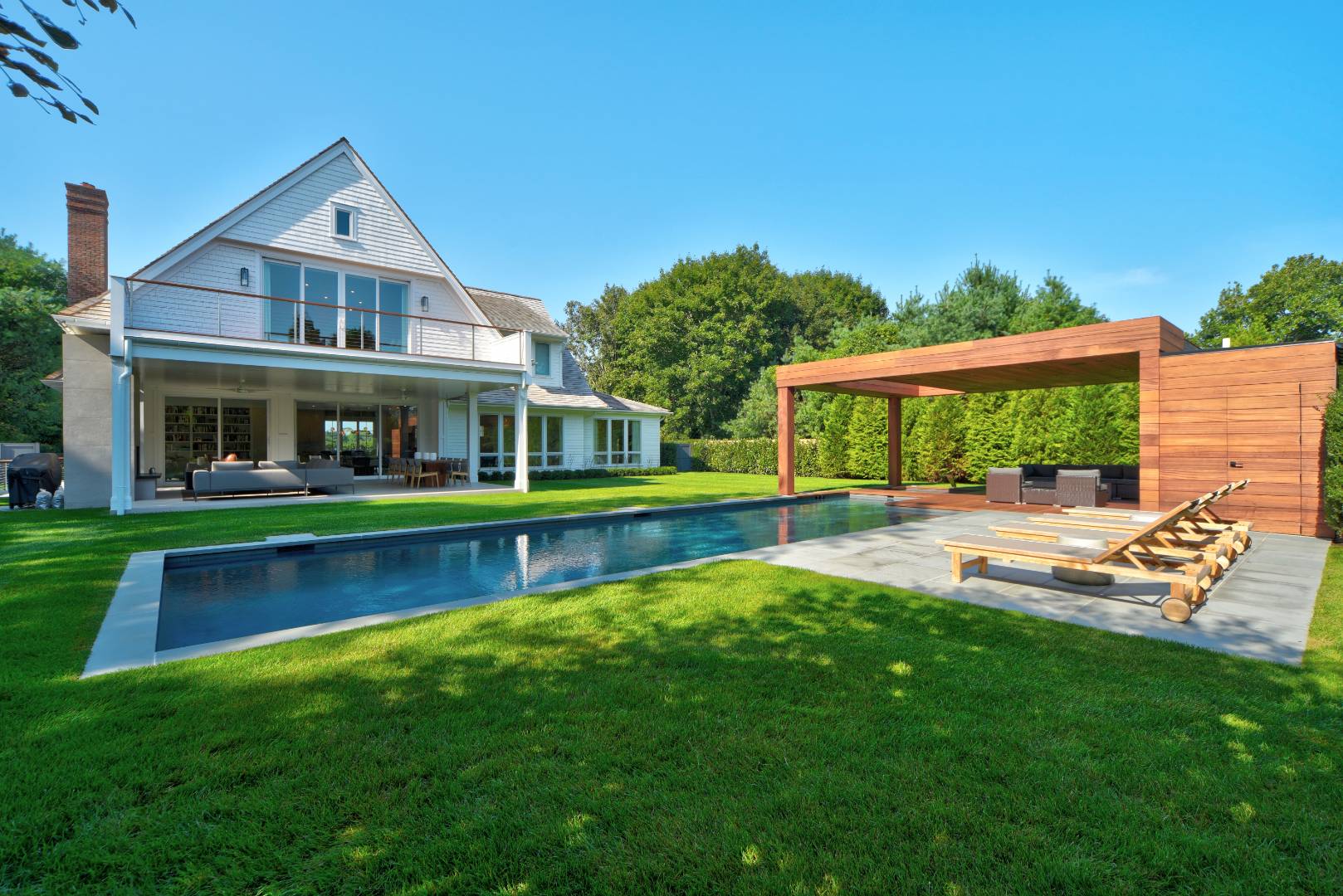 a front view of a house with a yard table and chairs