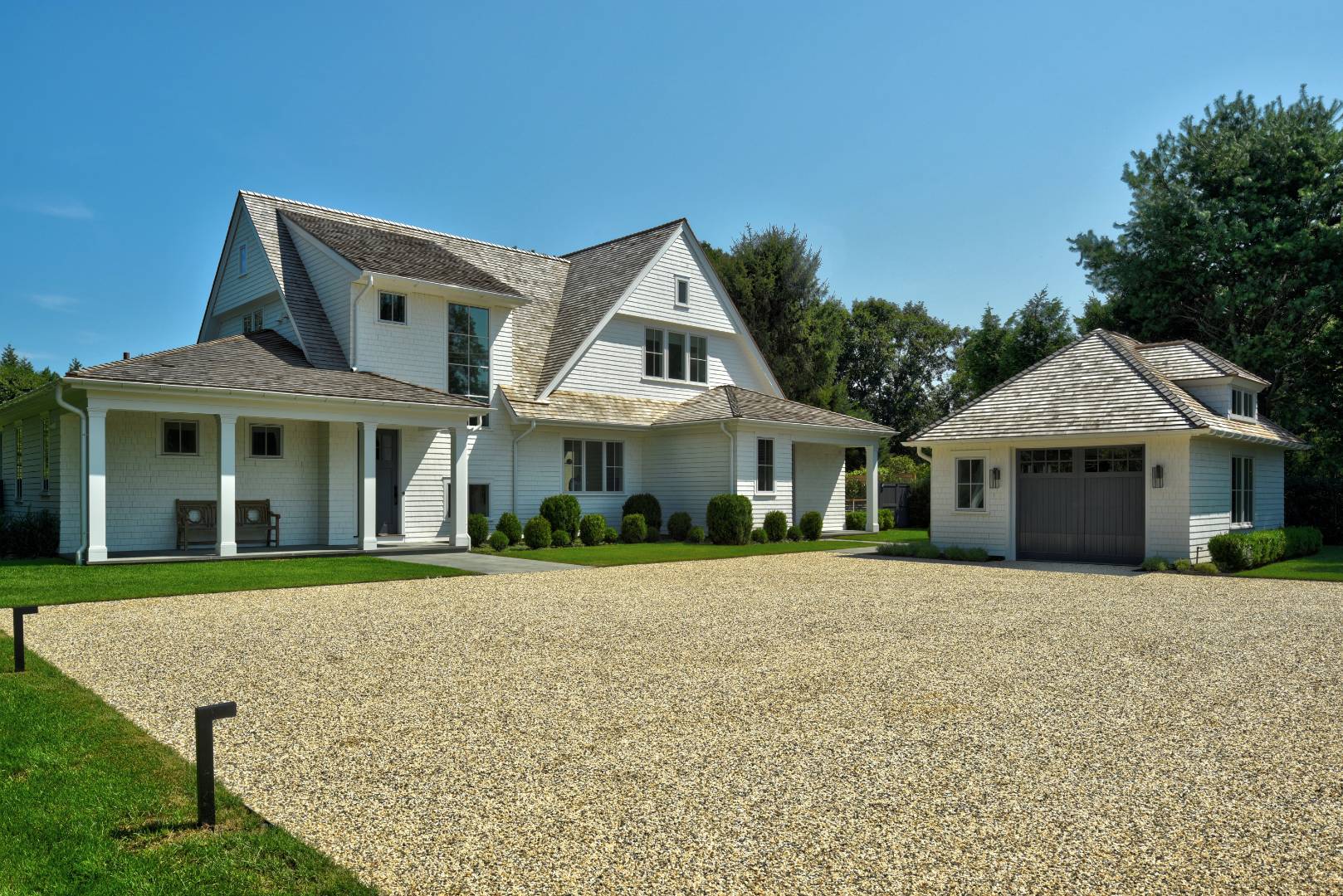 132 Long Lane East Hampton, NY 11937 - Photo 2 of 24 front view of a house with a yard