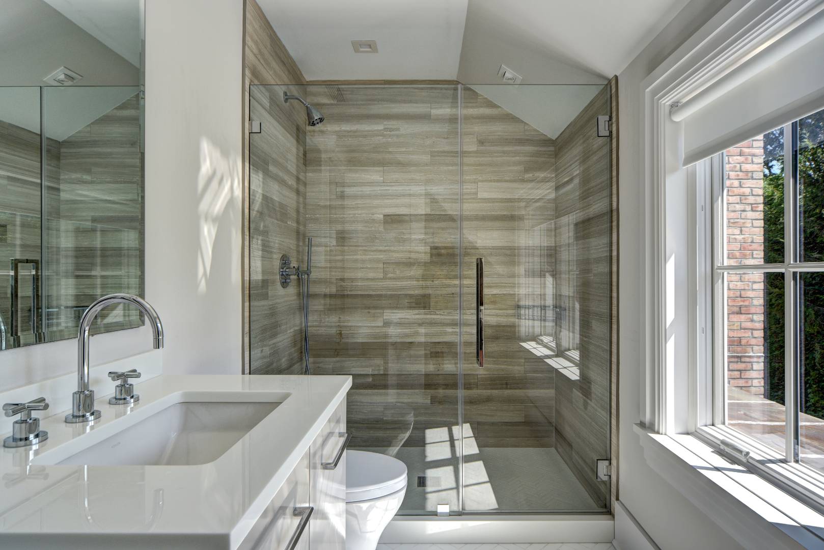 132 Long Lane East Hampton, NY 11937 - Photo 14 of 24 a bathroom with a bathtub shower sink vanity and toilet