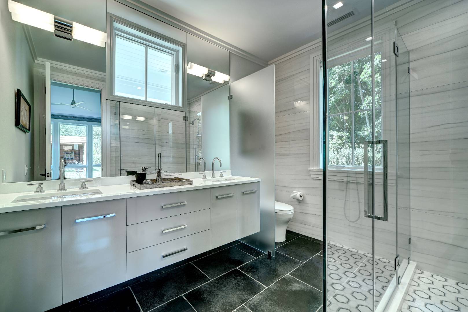132 Long Lane East Hampton, NY 11937 - Photo 21 of 24 a spacious bathroom with a double vanity sink toilet and shower