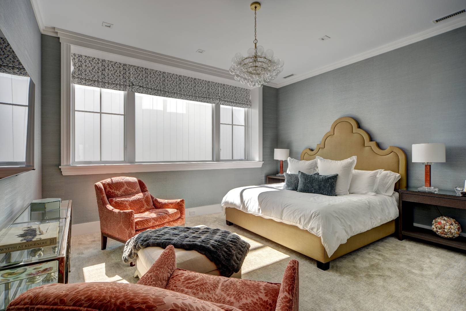 132 Long Lane East Hampton, NY 11937 - Photo 7 of 24 a bedroom with a bed and a chandelier