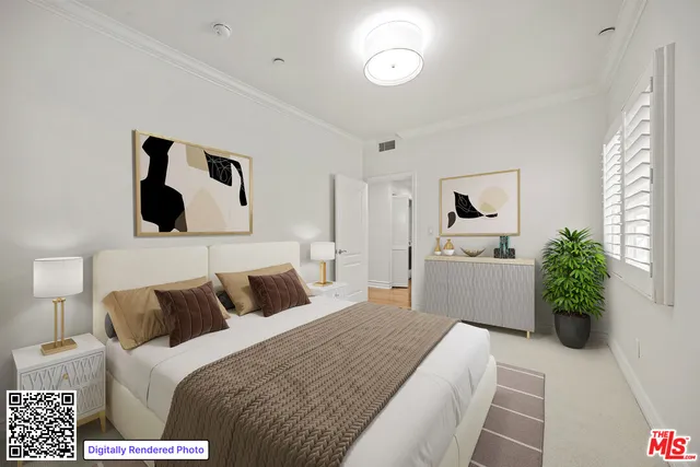 a bedroom with a bed and a potted plant