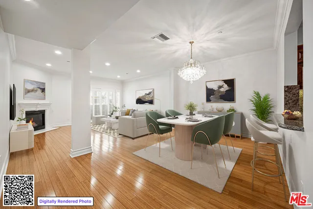a living room with furniture a fireplace and a dining table with wooden floor
