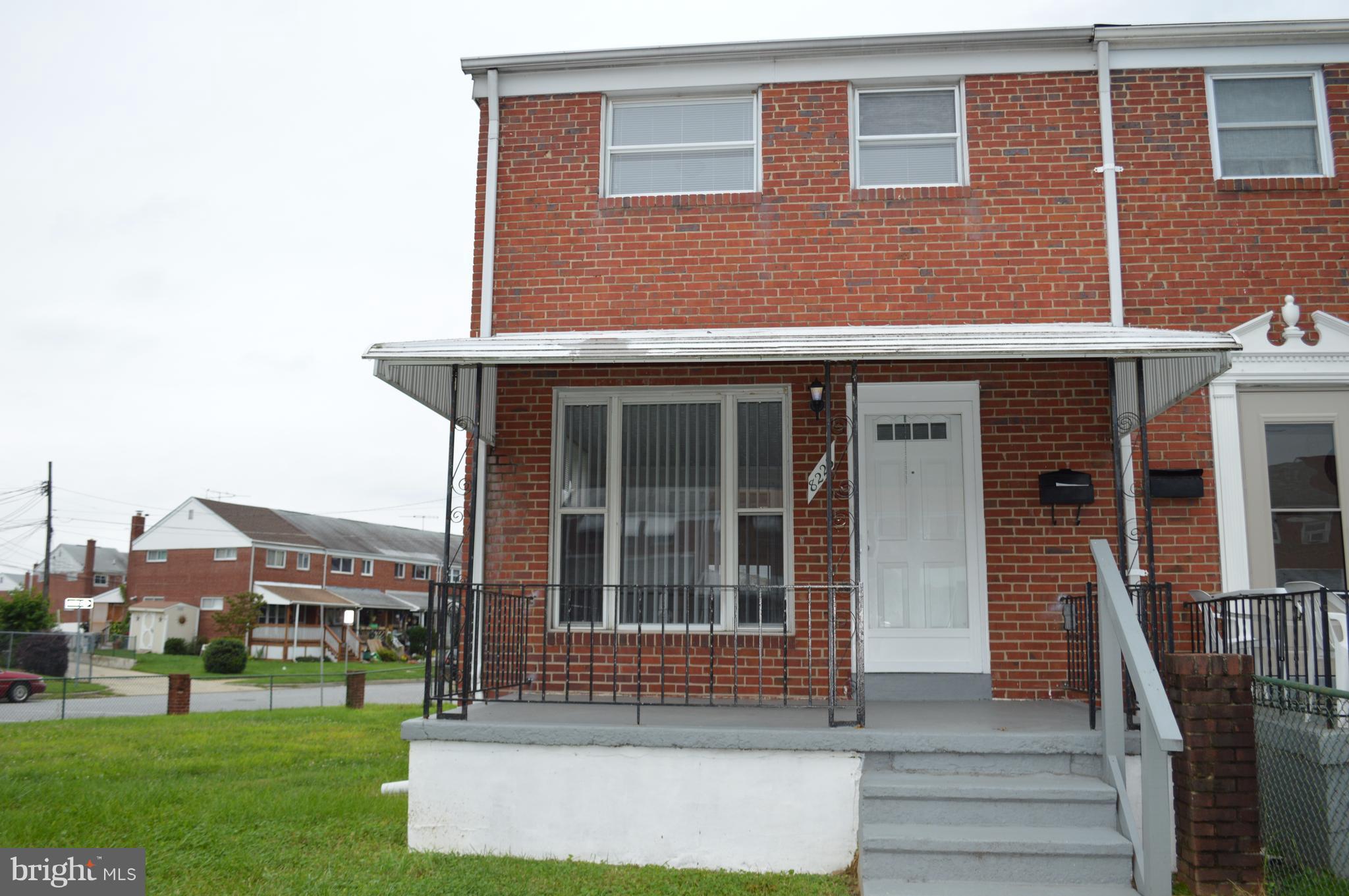 8223 Kavanagh Road Baltimore, MD 21222 - Photo 1 of 17 a front view of building with yard