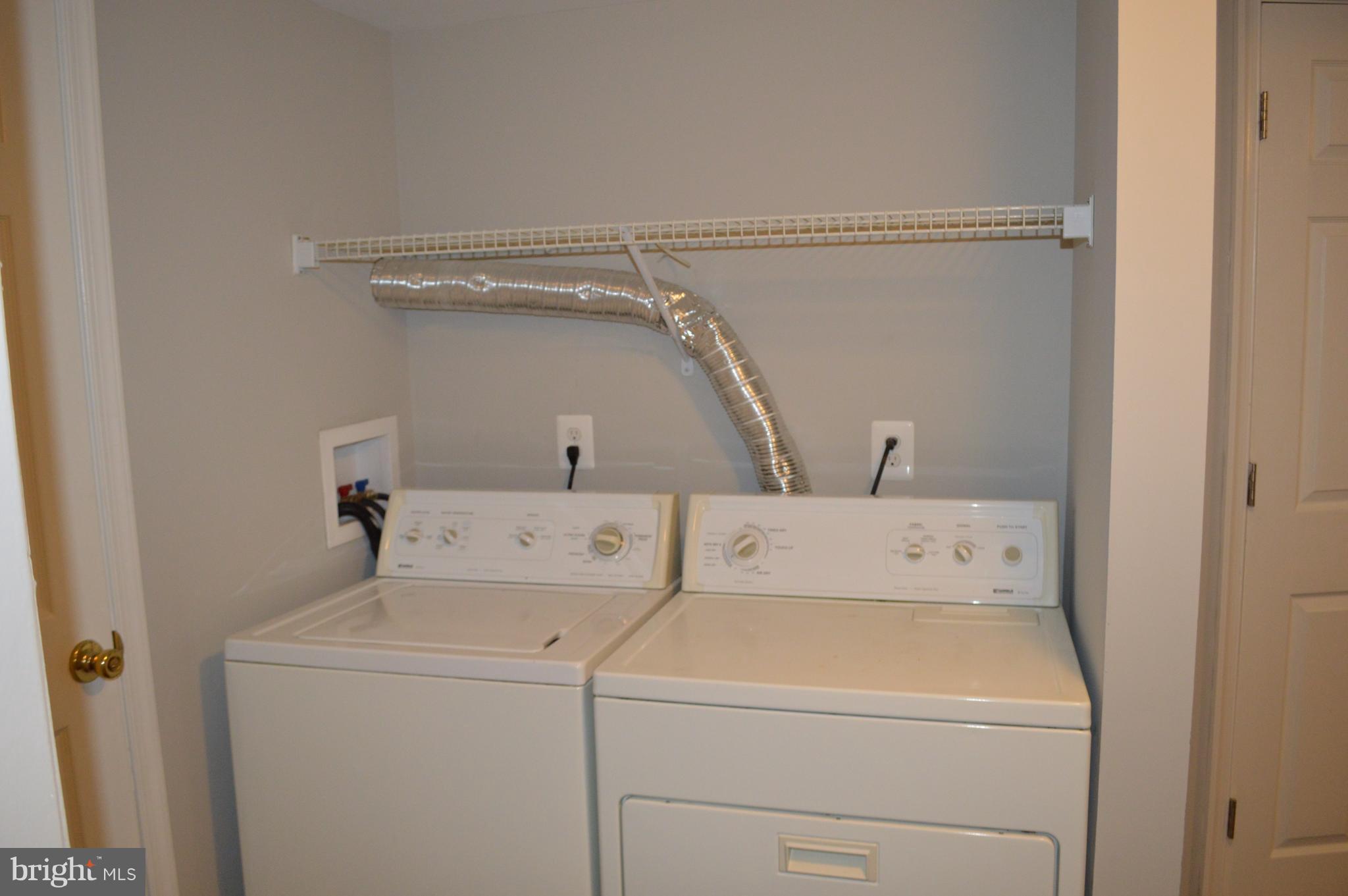 8223 Kavanagh Road Baltimore, MD 21222 - Photo 16 of 17 a utility room with dryer and washer