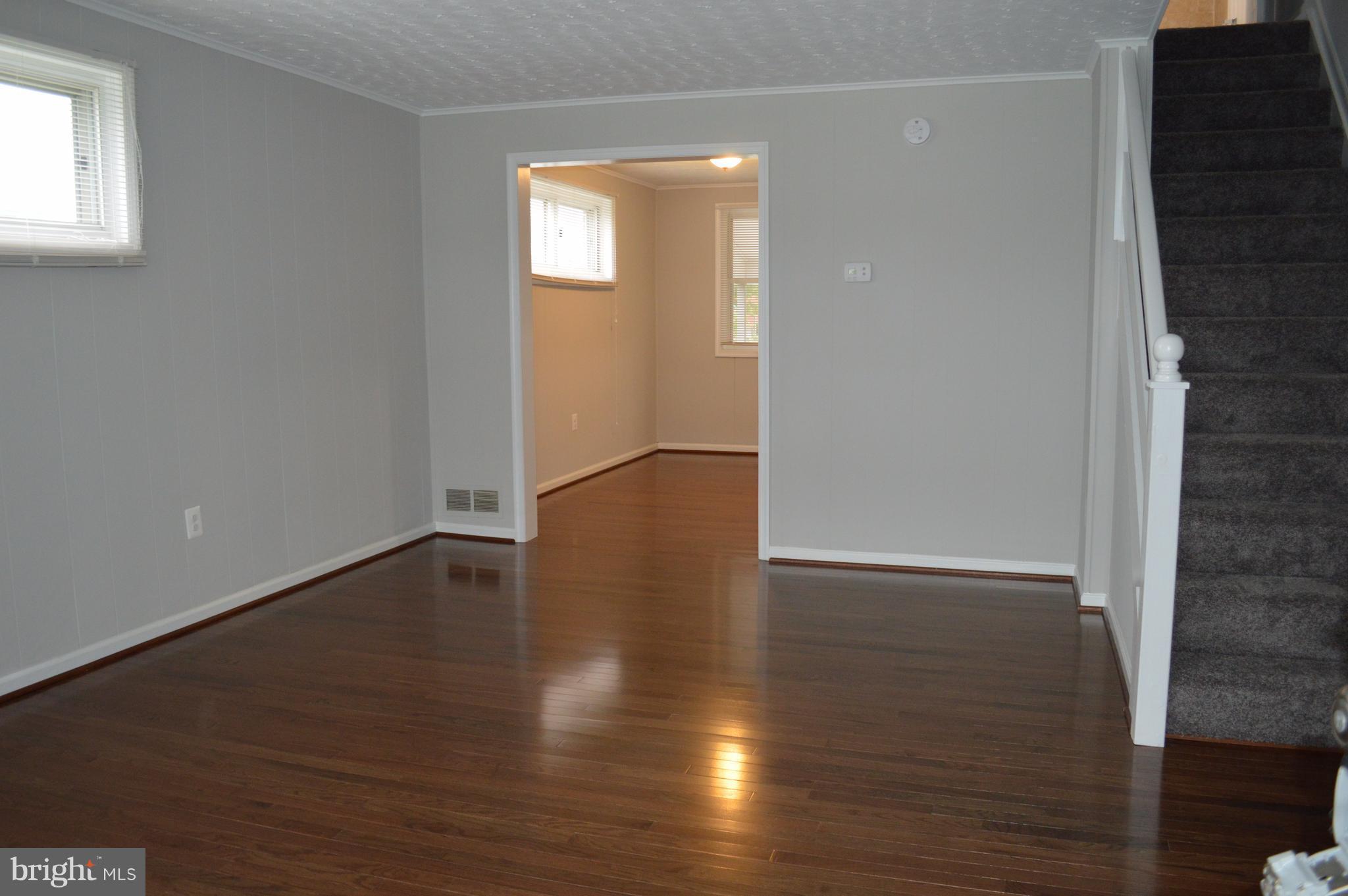 8223 Kavanagh Road Baltimore, MD 21222 - Photo 5 of 17 a view of a livingroom with wooden floor