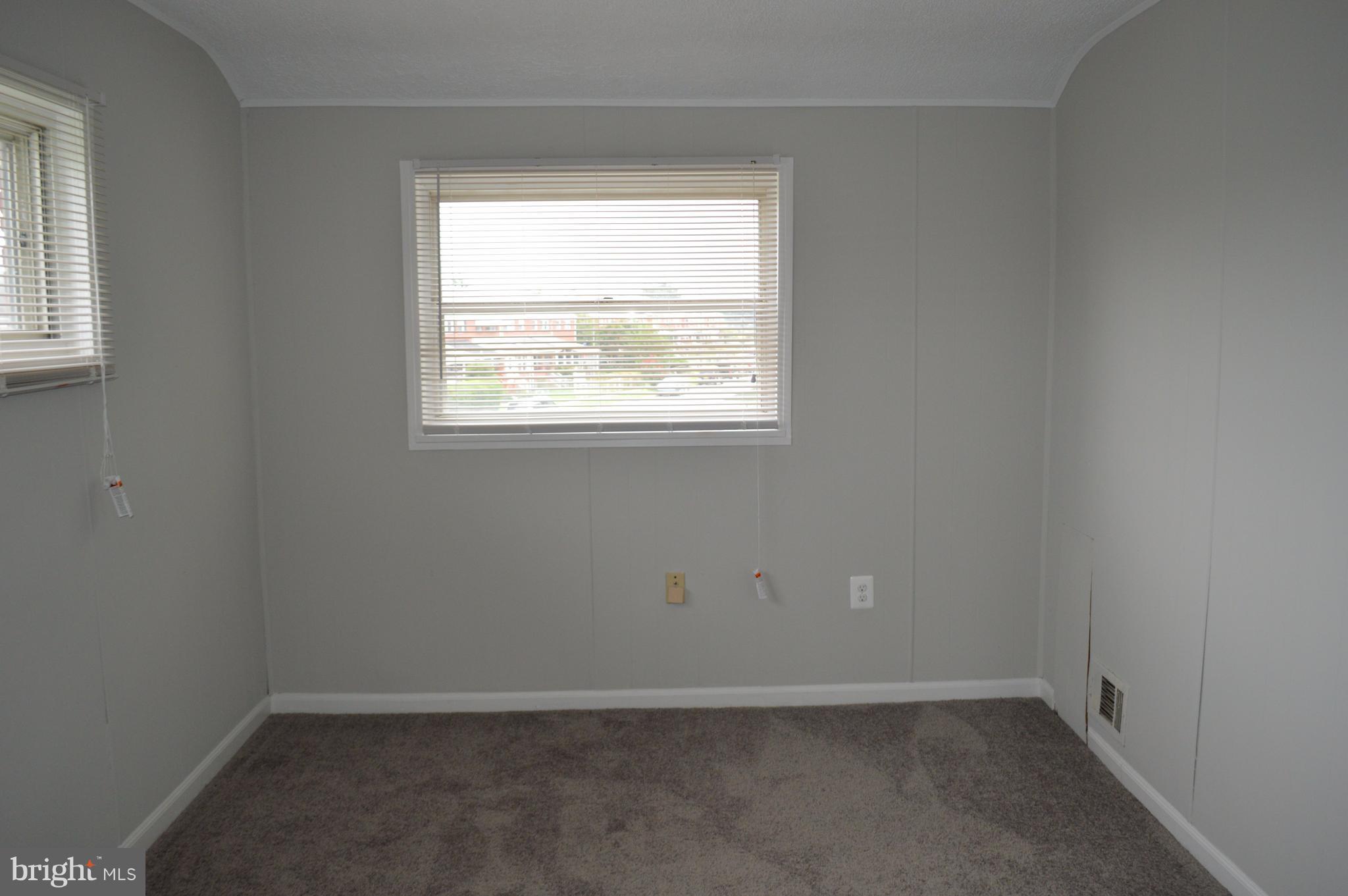 8223 Kavanagh Road Baltimore, MD 21222 - Photo 9 of 17 an empty room with a window
