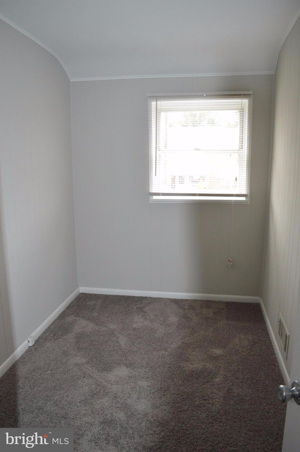 8223 Kavanagh Road Baltimore, MD 21222 - Photo 10 of 17 an empty room with a window