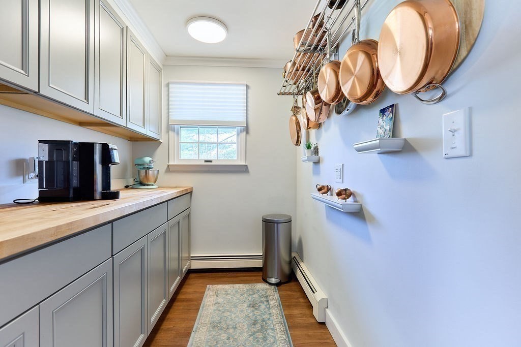 58 Buttercup Lane Hanover, MA 02339 - Photo 13 of 35 a kitchen with a sink and cabinets