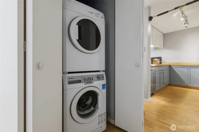 a view of a kitchen with a washer and dryer