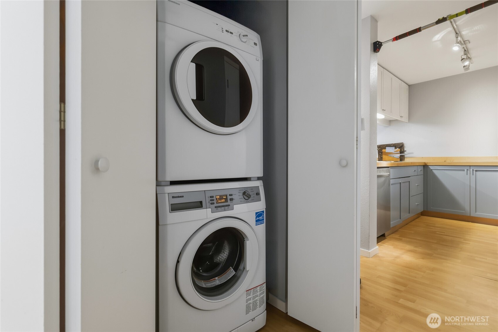 275 West Roy Street, Unit 412 Seattle, WA 98119 - Photo 13 of 34 a view of a kitchen with a washer and dryer