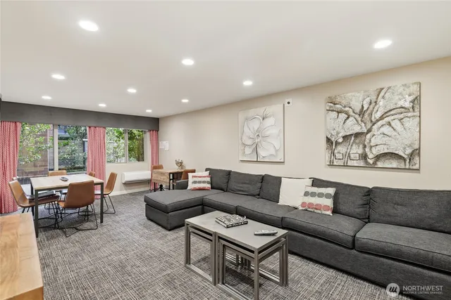 a living room with furniture and a large window