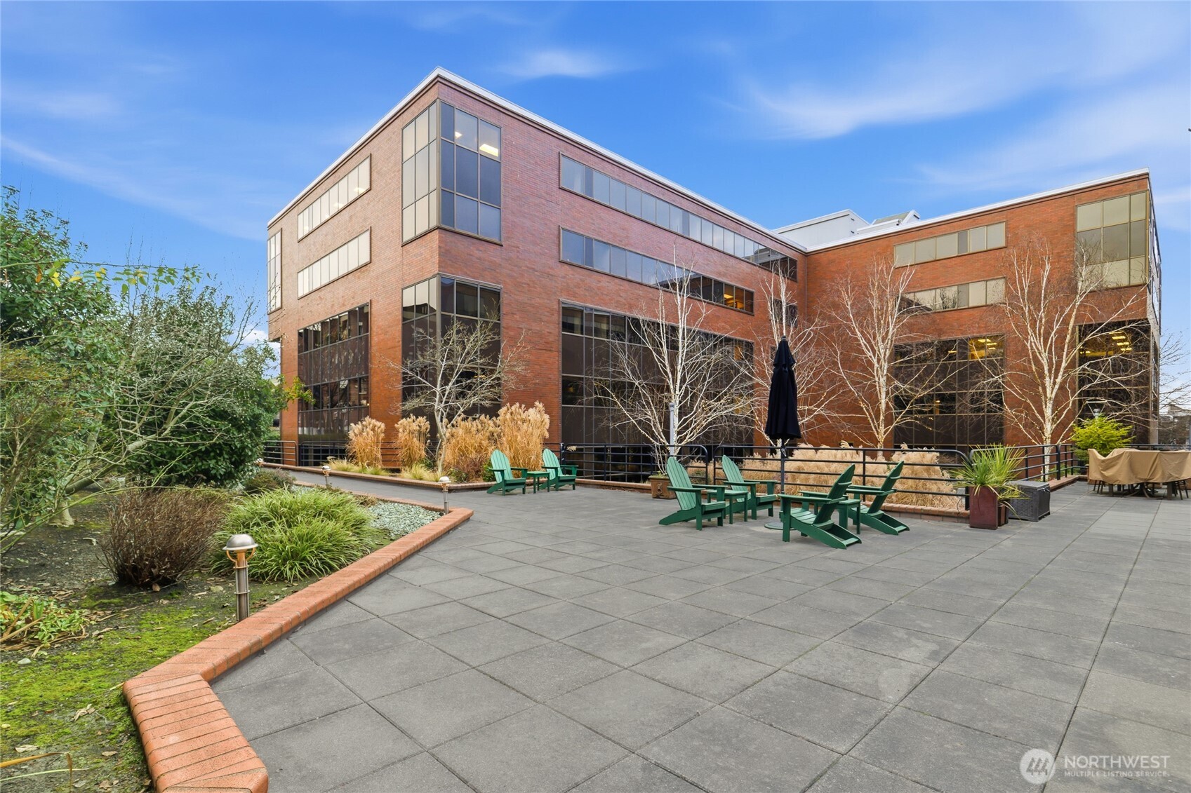 275 West Roy Street, Unit 412 Seattle, WA 98119 - Photo 18 of 34 a front view of a house with porch and sitting area