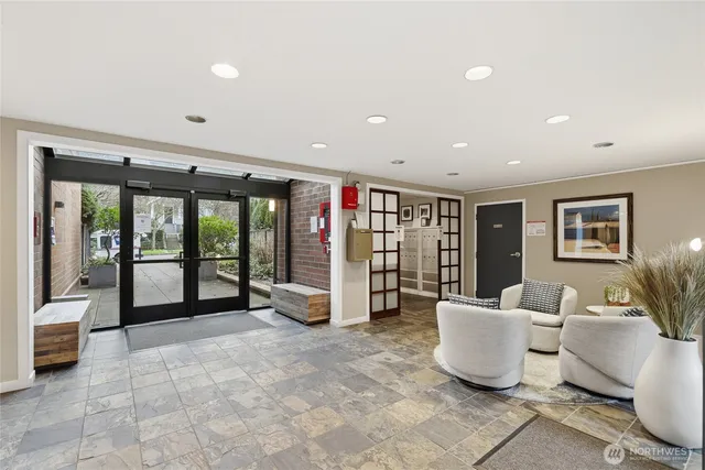 a spacious bedroom with a large bed and a couch