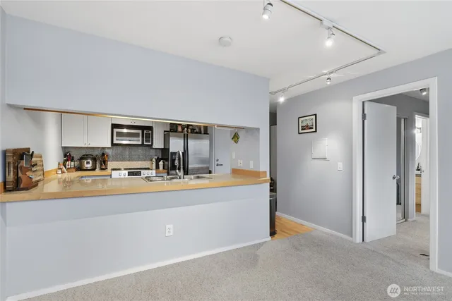 a view of living room and kitchen with furniture