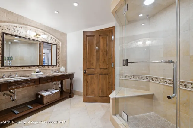 a bathroom with a double vanity sink mirror and double