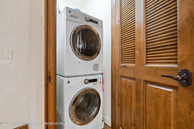 a view of a hallway with washer and dryer
