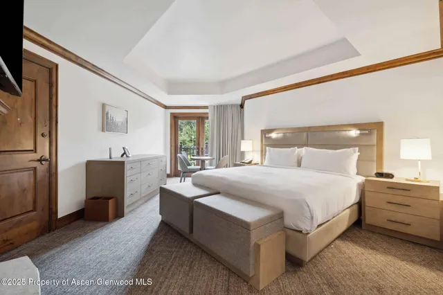 a bedroom with bed and window