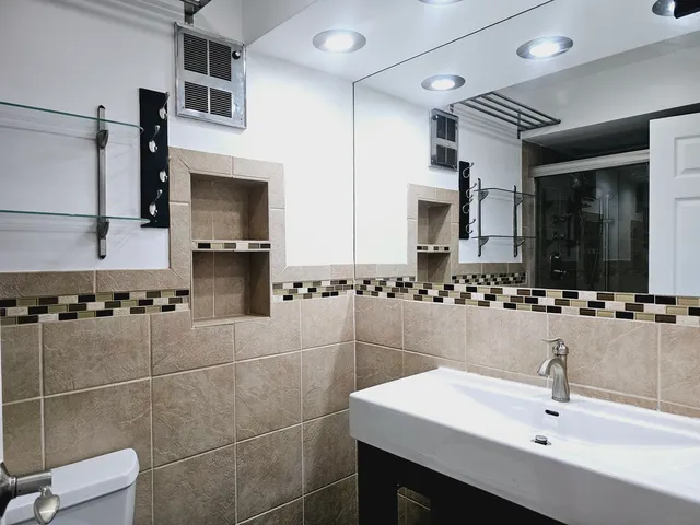 a bathroom with a sink and a mirror