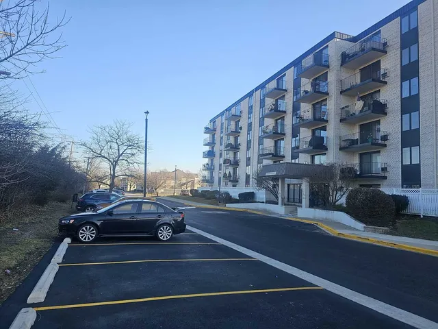 a view of a city street with tall buildings