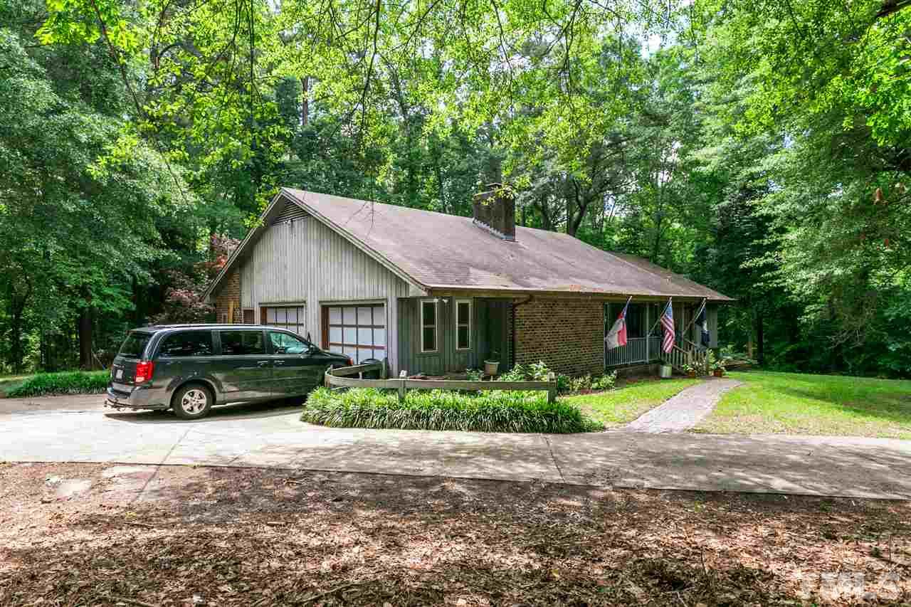 4609 Forestville Road Raleigh, NC 27616 - Photo 1 of 4 a house view with a garden space