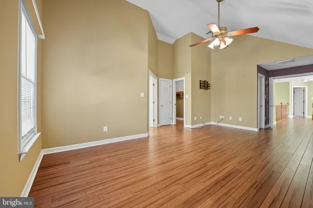 a spacious bathroom with a granite countertop sink and a large mirror