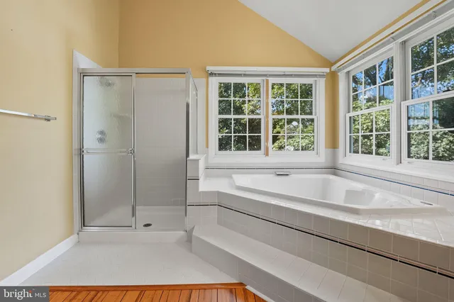 a view of backyard with deck and wooden floor
