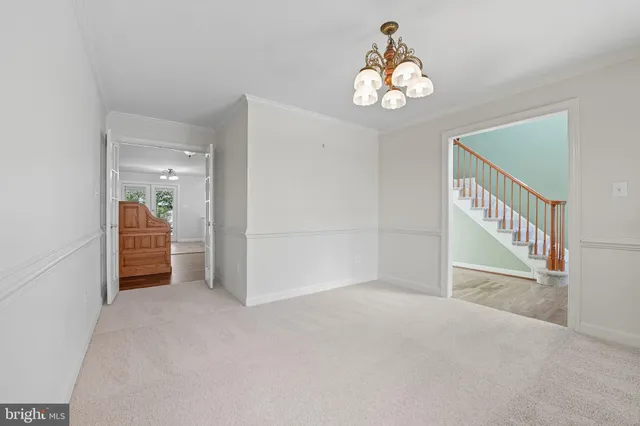 an empty room with windows and entrance