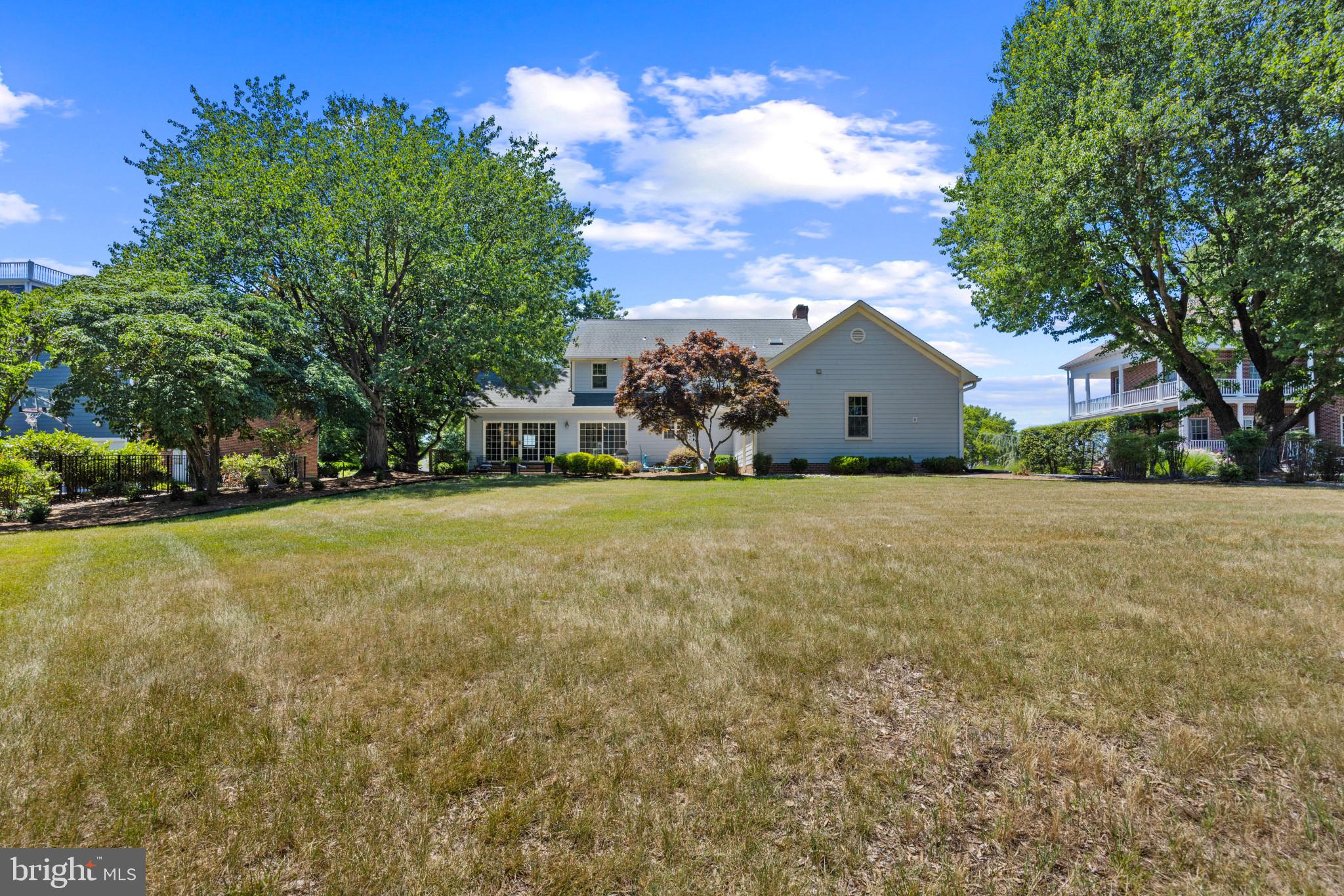 3403 Hidden River View Road Annapolis, MD 21403 - Photo 35 of 50 a view of a house with a yard